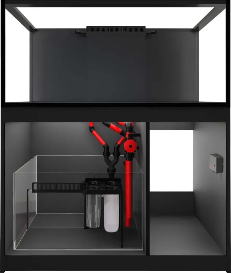 Der Reefer 425 G3 von vorn mit offenem Unterschrank, oben das leere Becken im schwarzen Rahmen, unten das Technikbecken mit roten Rohren und daneben ein freies Fach.
